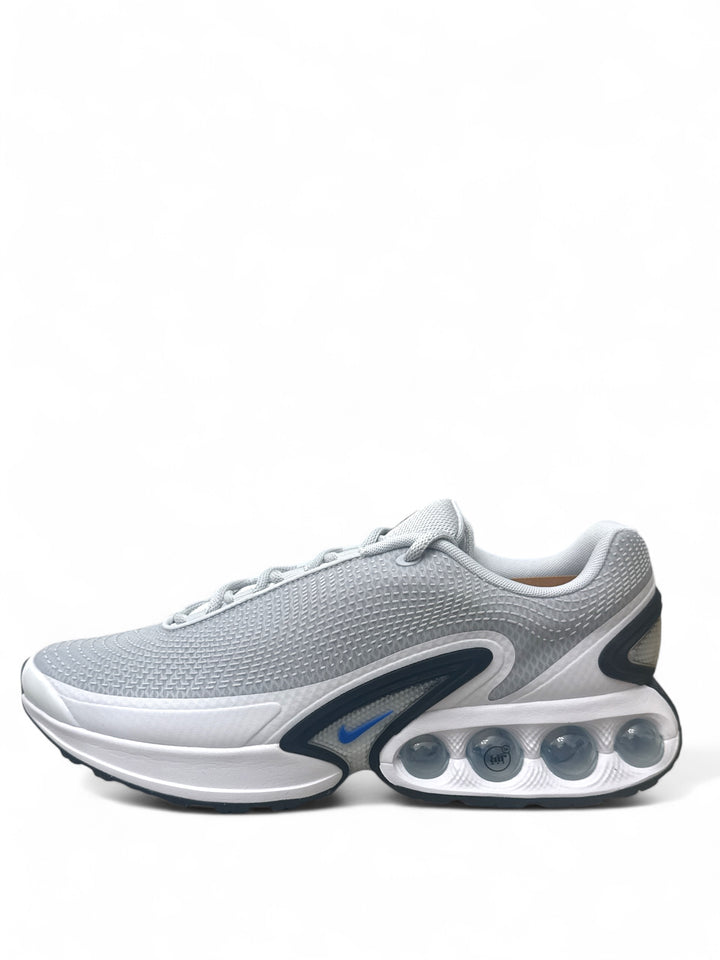 Nike Air Max Dn Pure Platinum Hyper Royal side view showing breathable mesh upper and cushioning design.