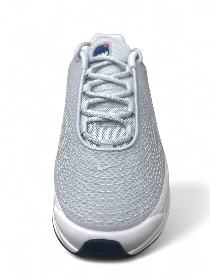 Nike Air Max Dn Pure Platinum Hyper Royal sneaker top view showcasing breathable mesh upper.