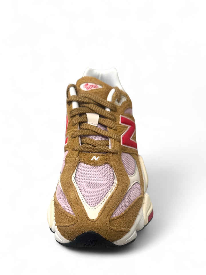 Front view of New Balance 9060 True Red sneakers showcasing premium materials and chunky silhouette.