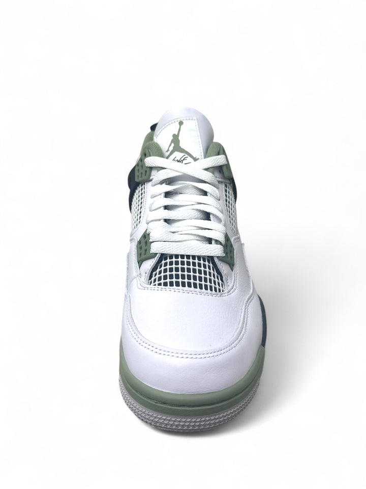 Jordan 4 Retro Seafoam sneakers top view showcasing white upper and seafoam green accents.