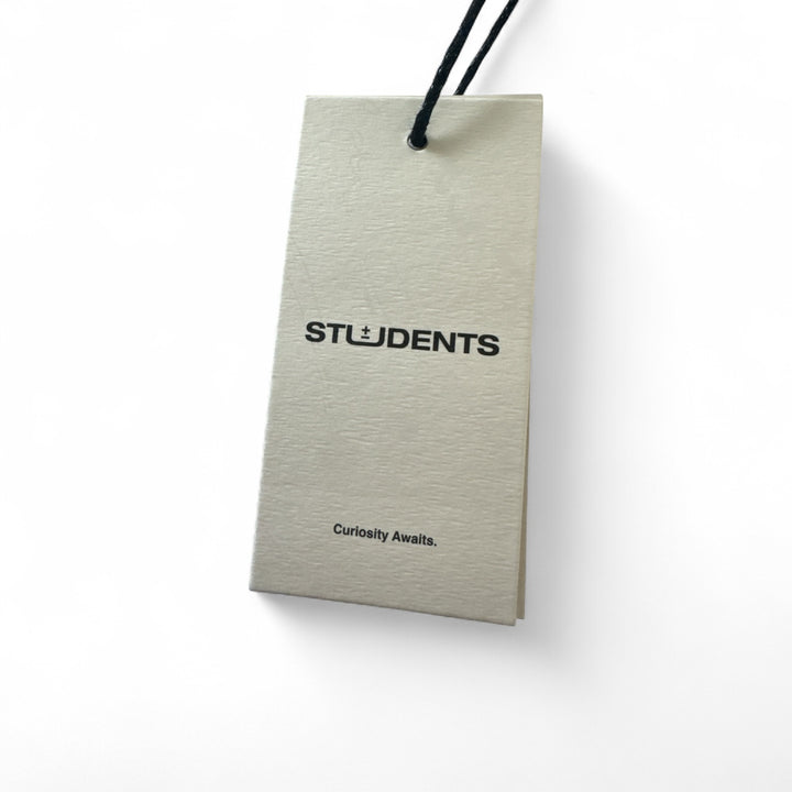 Tag for Students Golf Major Undulations T-Shirt with logo and text 'Curiosity Awaits'.