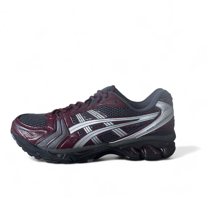 ASICS Gel-Kayano 14 running shoes in Obsidian Grey and Pure Silver side view.