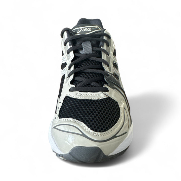 ASICS Gel-Kayano 14 sneakers in Obsidian Grey and Cement, showcasing the sleek design and breathable material.