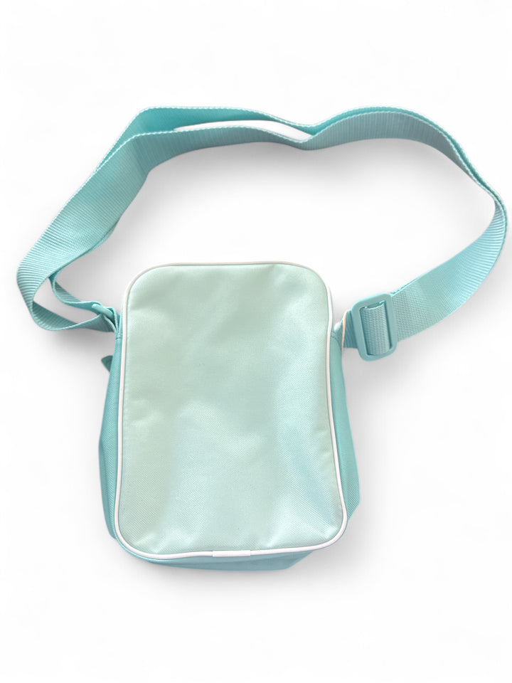 adidas festival crossbody bag in light blue color, featuring durable materials and adjustable strap.