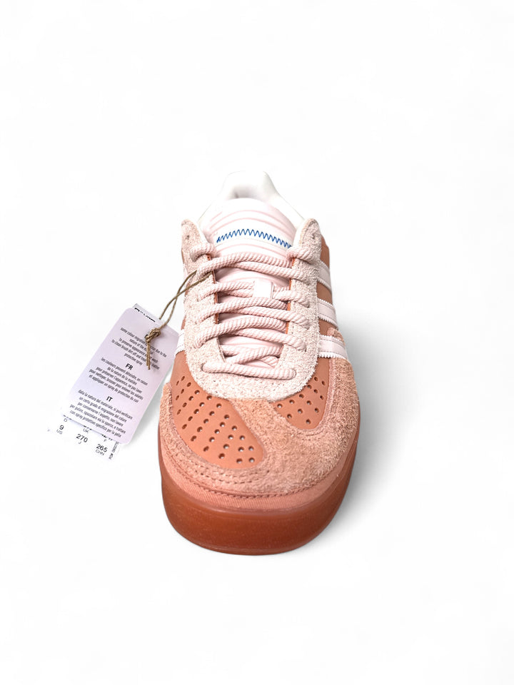 adidas Gazelle Bad Bunny sneakers in a light pink color with perforated details and unique tag.