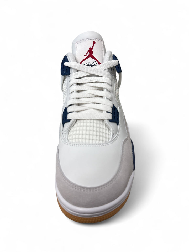 Jordan 4 Retro SB Navy sneakers viewed from the top, featuring a white, navy, and gum sole design.