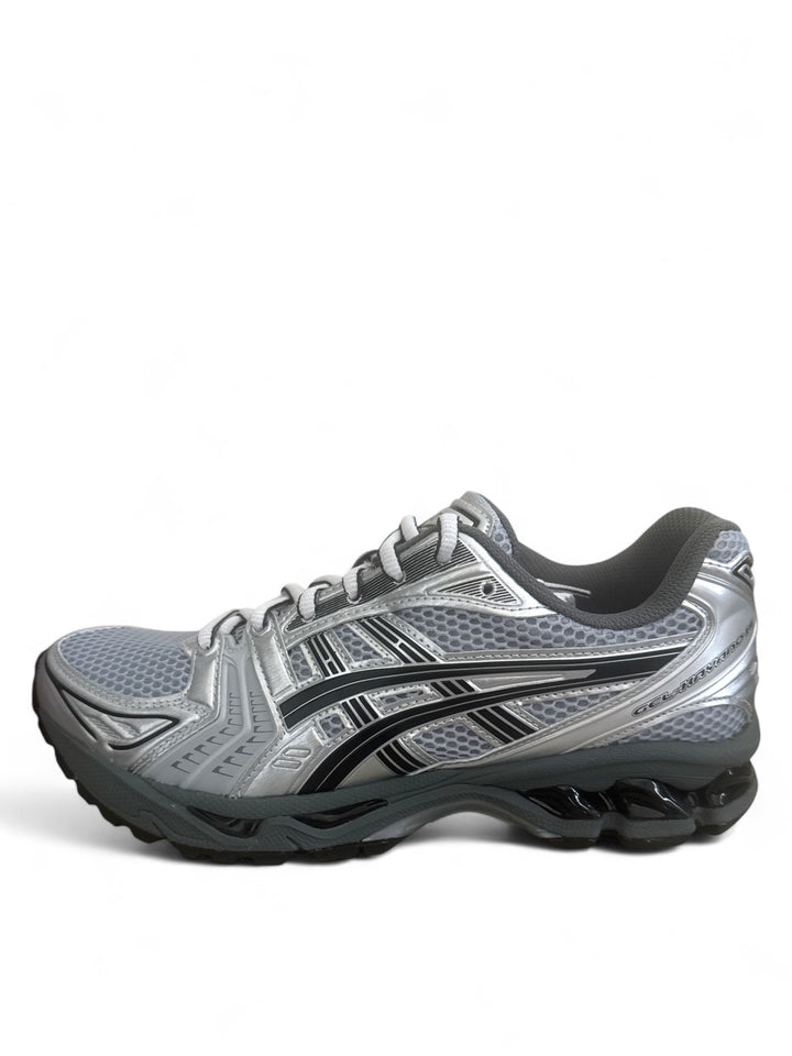 ASICS Gel-Kayano 14 running shoes in gray with black accents, designed for comfort and performance.
