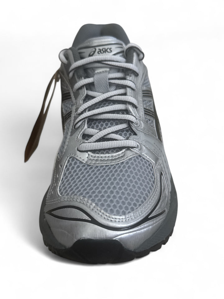 ASICS Gel-Kayano 14 running shoes in grey, featuring breathable mesh upper and supportive design.