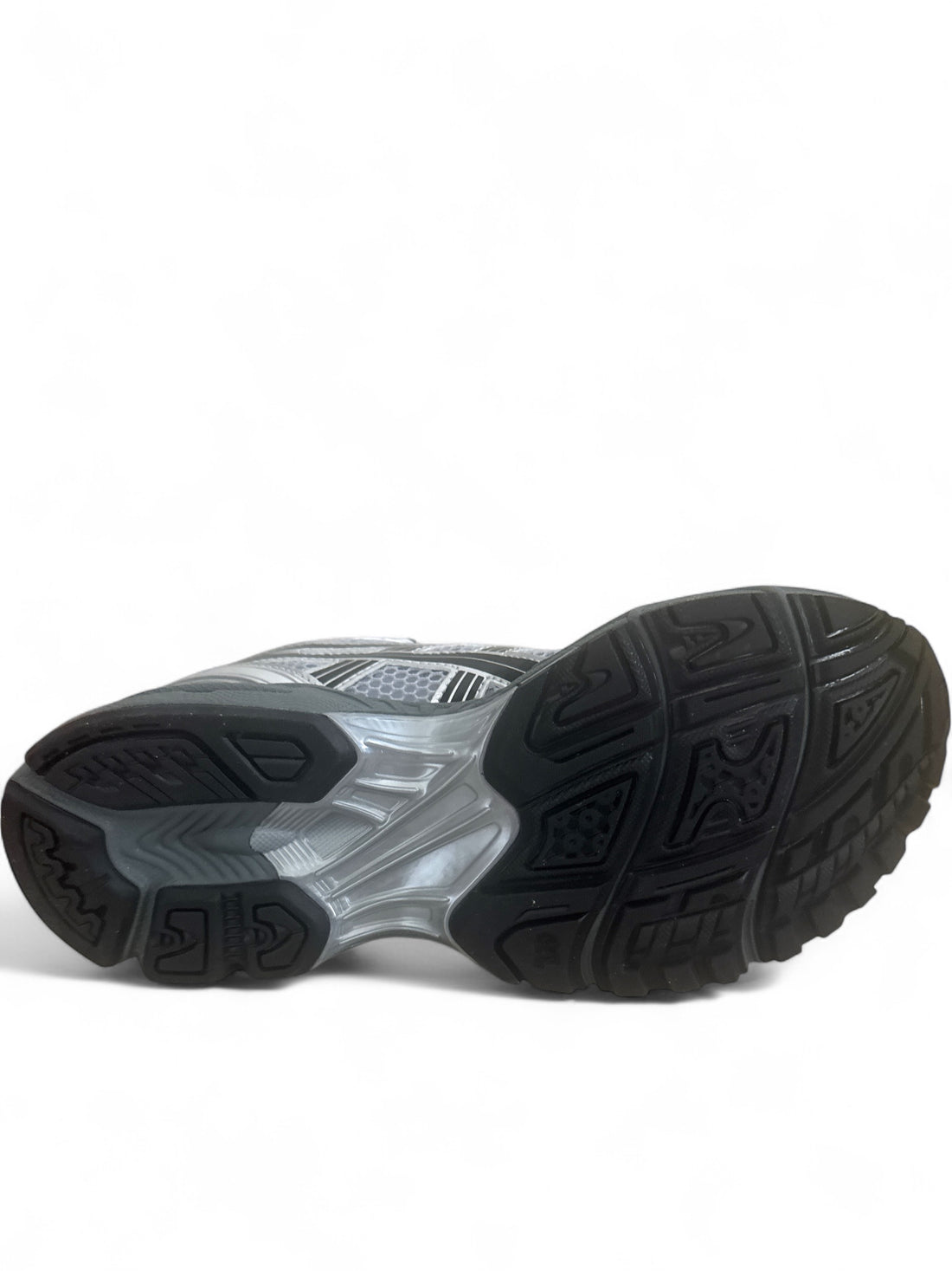 ASICS Gel-Kayano 14 running shoes bottom view with rubber outsole showing grip design.
