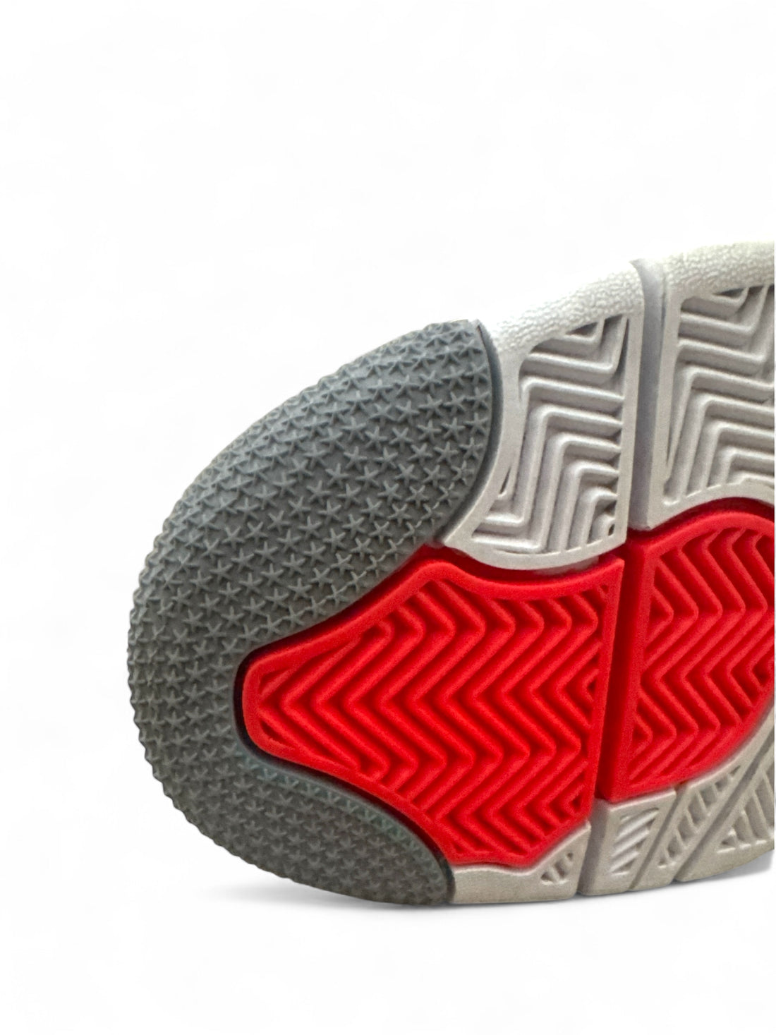 Sole view of the Jordan 4 Retro Infrared VNDS showing grey and bold Infrared accents on the outsole.