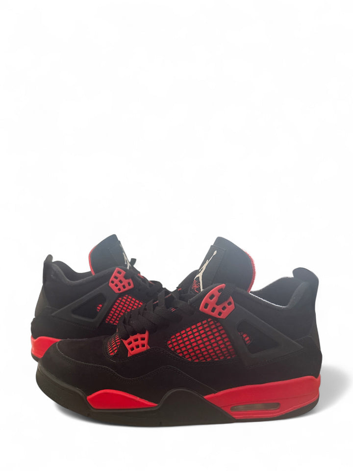 pre-owned Jordan 4 Retro Red Thunder sneaker in black and red colorway with nubuck construction.