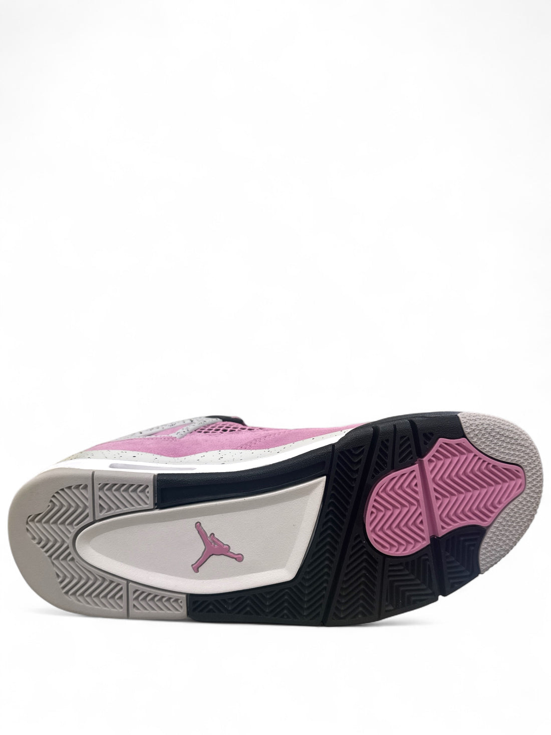 Jordan 4 Retro Orchid sneaker sole view showcasing orchid colorway and iconic Jordan logo.