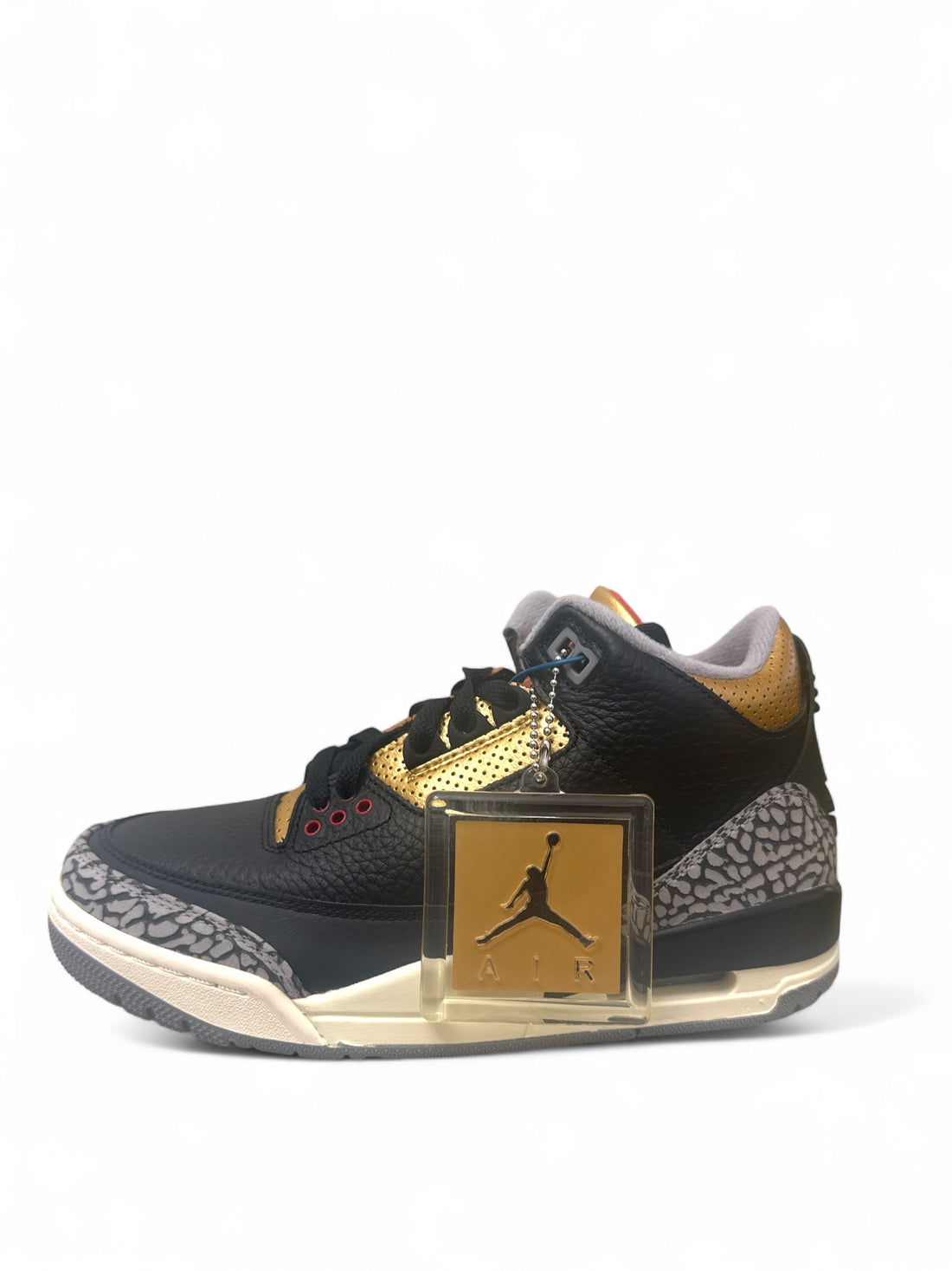 Jordan 3 Retro Black Cement Gold sneaker featuring black upper and gold accents with elephant print overlays.