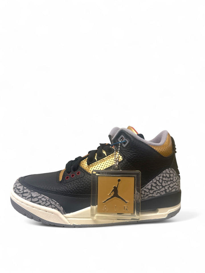 Jordan 3 Retro Black Cement Gold sneaker featuring black upper and gold accents with elephant print overlays.