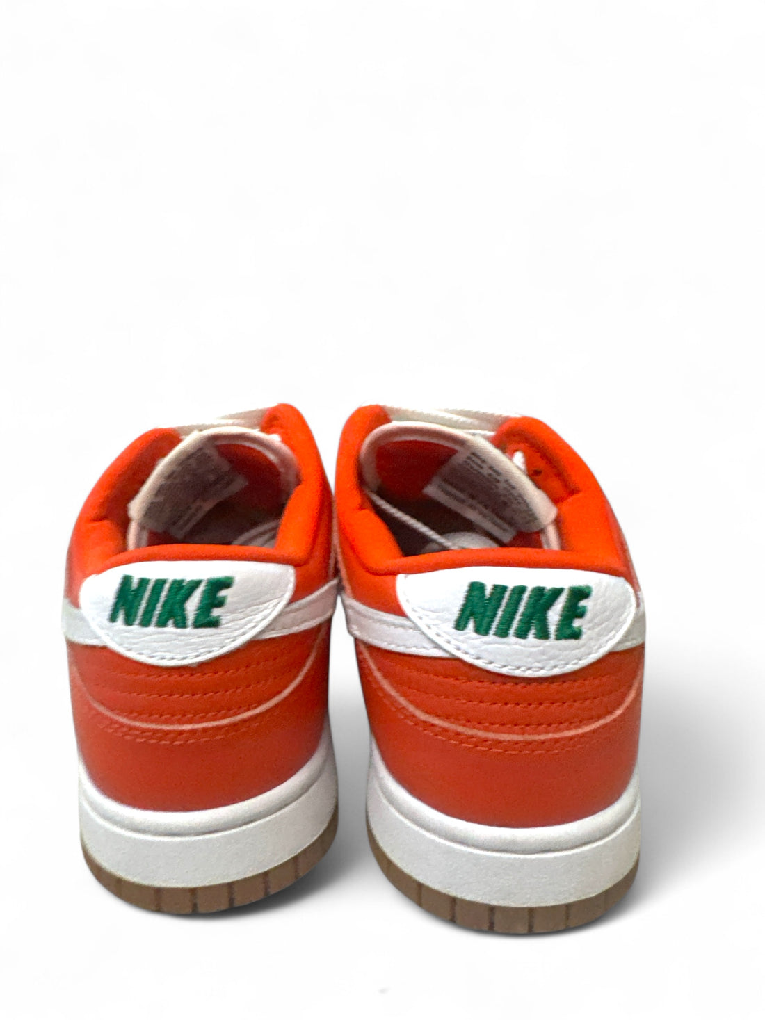 Nike Dunk Low 7-Eleven custom sneakers featuring bold orange design and classic Nike logo on the back.