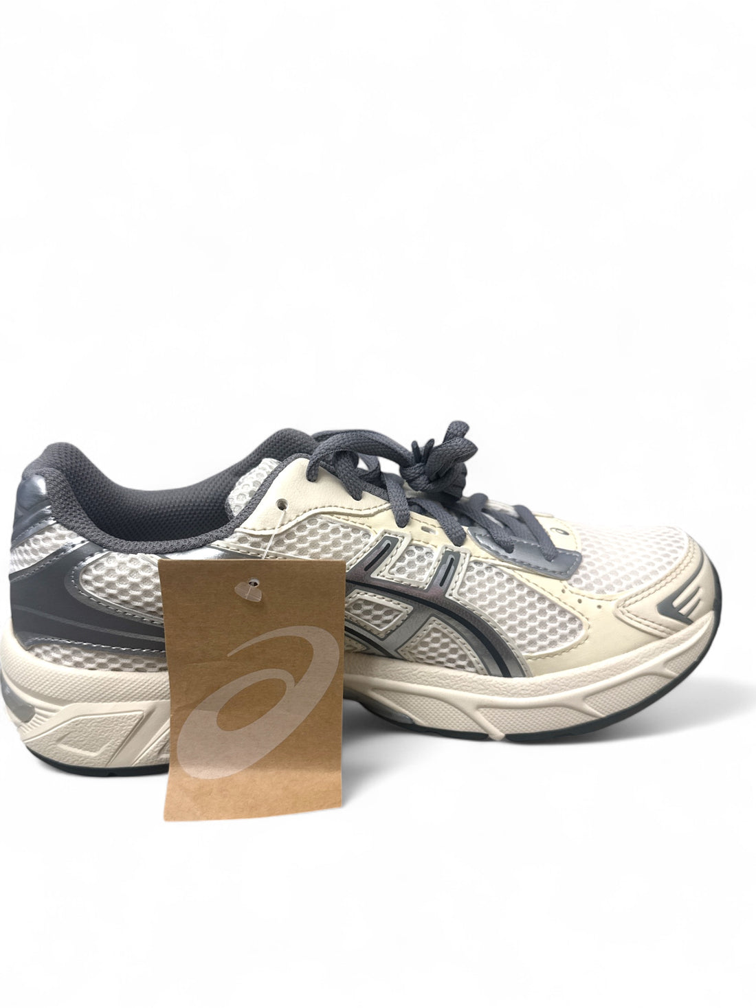 ASICS Gel-1130 running shoes in beige and navy, showcasing modern cushioning and breathable mesh design.