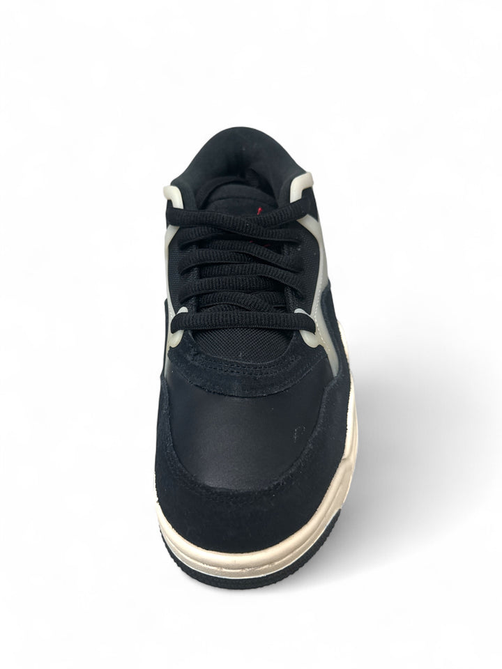 Jordan 4 Black Sail GS sneakers, top view of stylish black sneaker with cream accents.