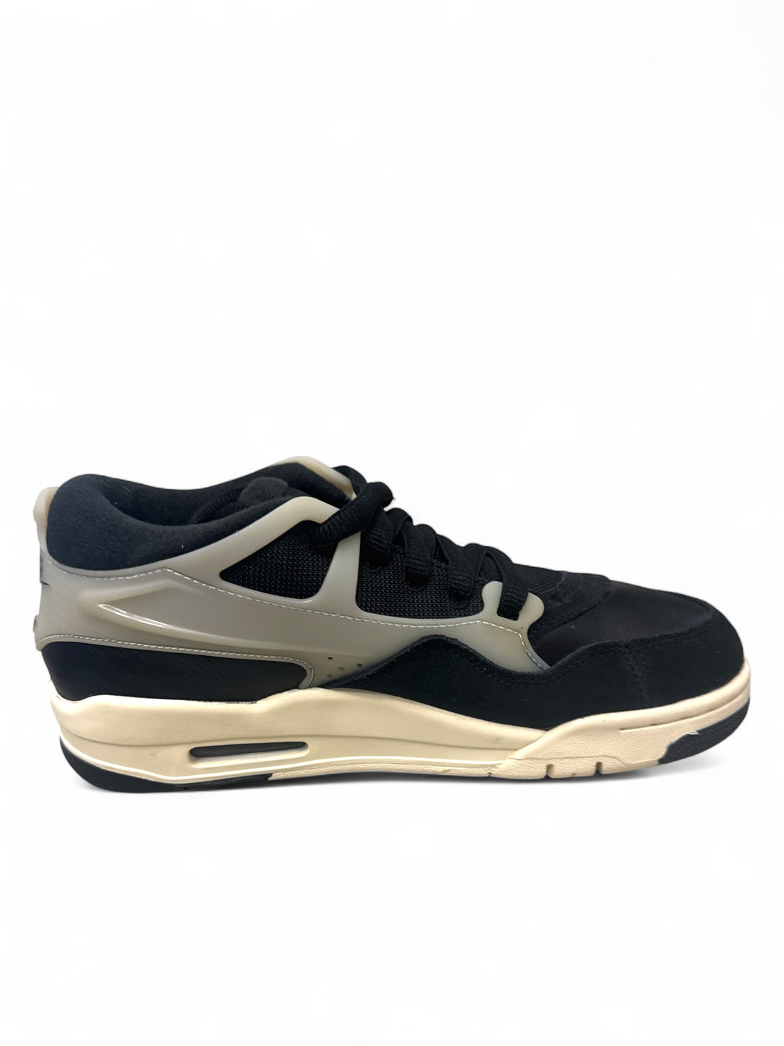 Jordan 4 Black Sail GS sneakers side view with black and beige colorway, showcasing sporty design.
