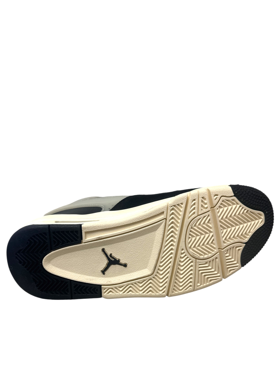 Sole view of Jordan 4 Black Sail GS sneakers showcasing detailed traction design.