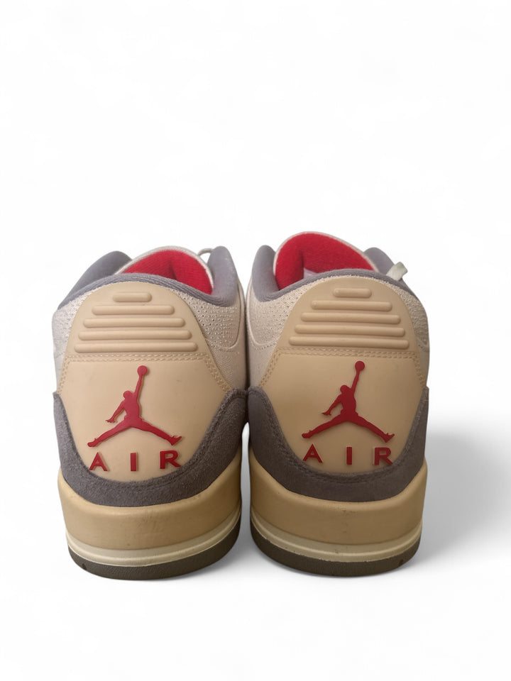 pre-owned Jordan 3 Retro Muslin sneakers from the back view showcasing the iconic logo.