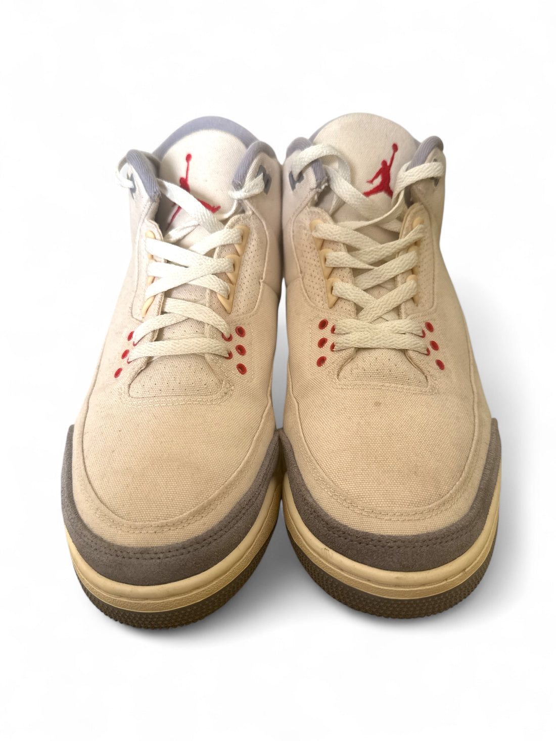 Pre-owned Jordan 3 Retro Muslin sneakers, featuring a beige and grey suede upper with red accents.