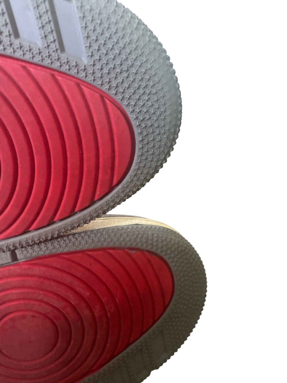 Bottom view of pre-owned Jordan 3 Retro Muslin sneakers showcasing red and grey sole patterns.