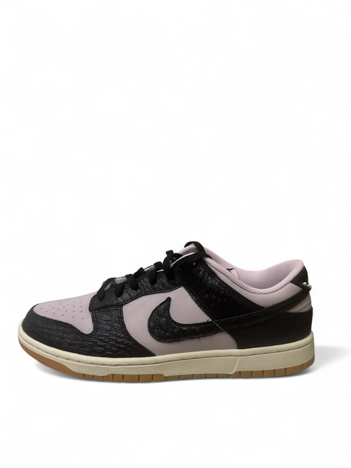 Nike Dunk Low Retro Pink Foam Black stylish sneaker side view with black and pink design.