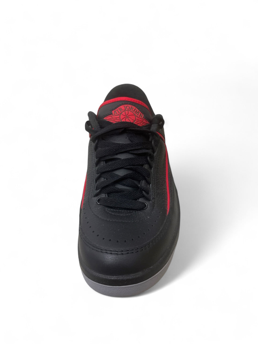 Jordan 2 Retro Low Christmas sneakers featuring a black and red colorway with premium leather construction.