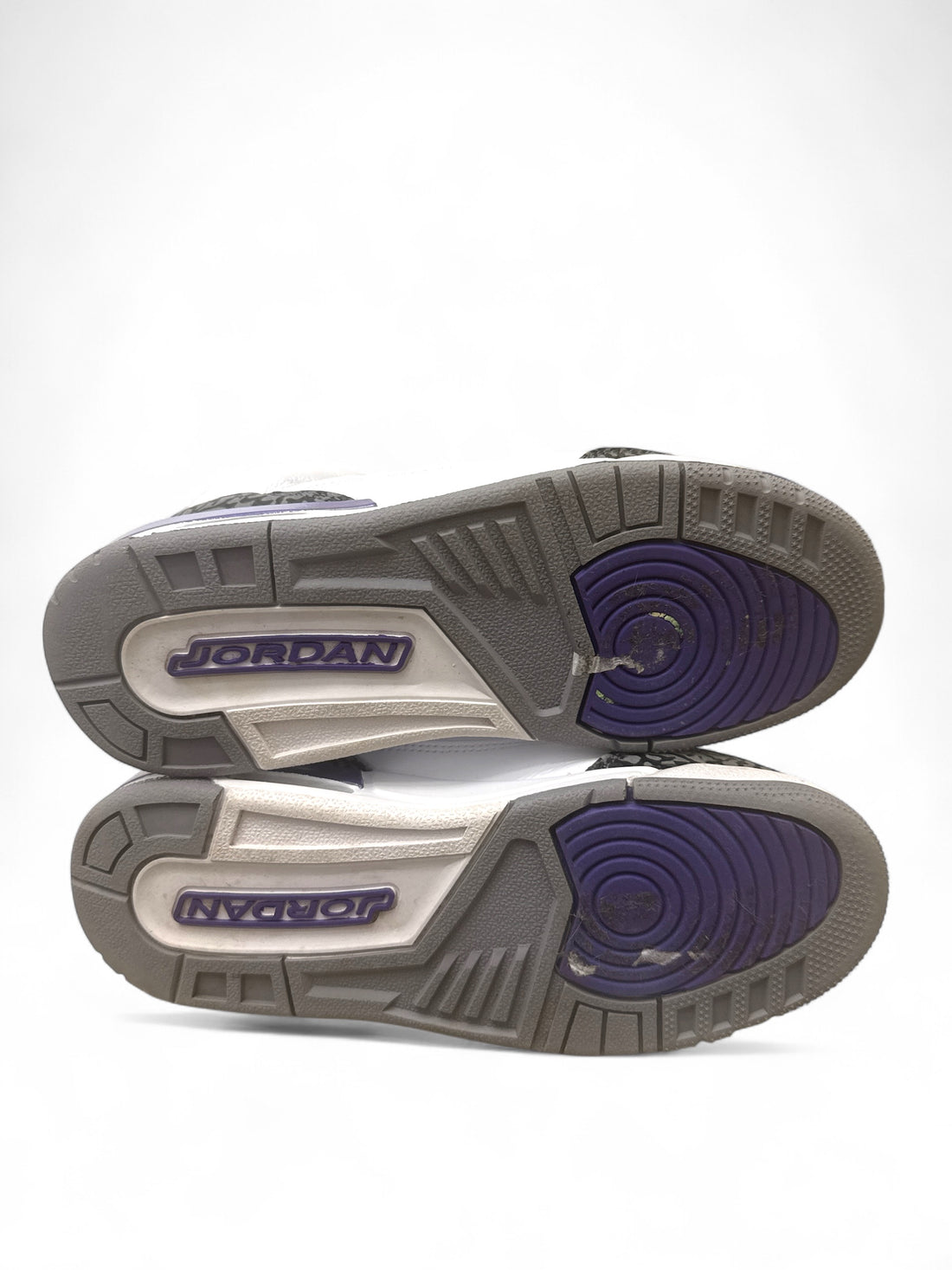 Bottom view of the Jordan 3 Retro Dark Iris 6.5Y sneakers showing the soles and design details.