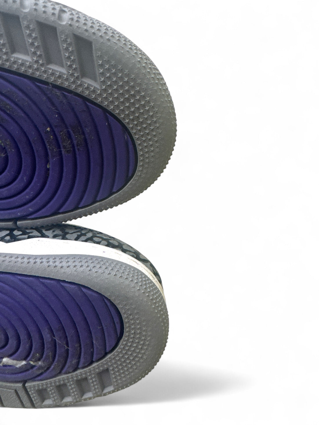 Sole of Jordan 3 Retro Dark Iris 6.5Y sneakers featuring purple tones and textured design.