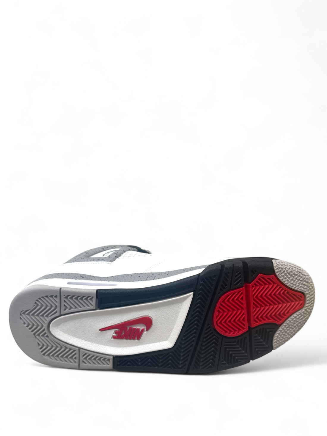 Sole view of Jordan 4 Retro White Cement featuring grey and black design with red accents.