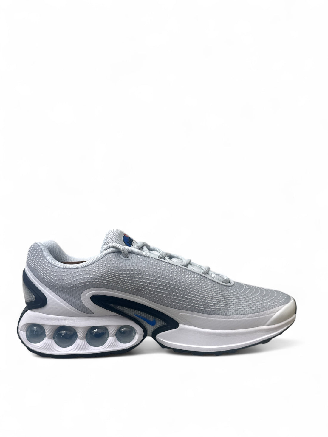 Nike Air Max Dn Pure Platinum Hyper Royal side view showcasing breathable mesh upper and innovative cushioning.