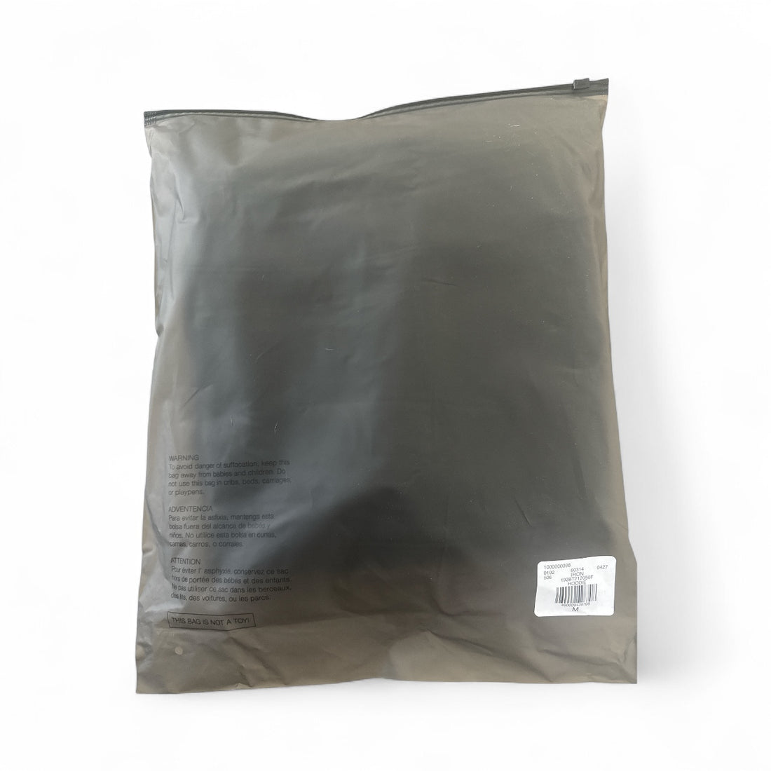 Fear of God Essentials hoodie packaging, featuring a sleek black design and product information label.
